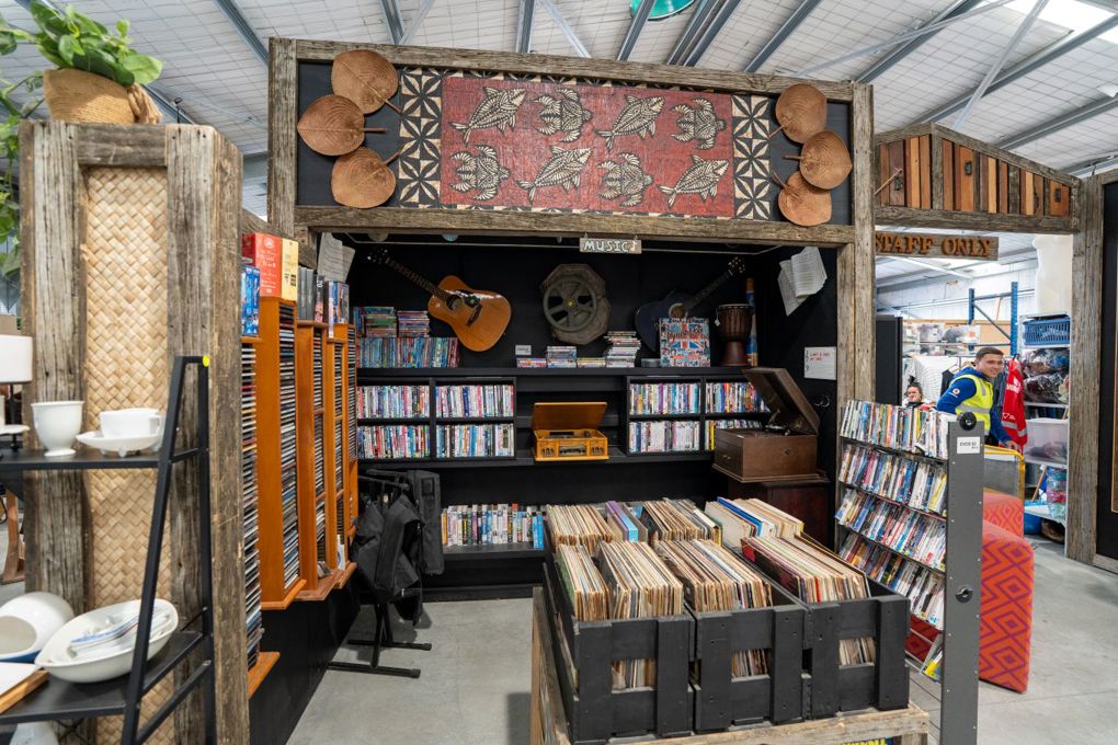 A shelf full of secondhand vinyls and books