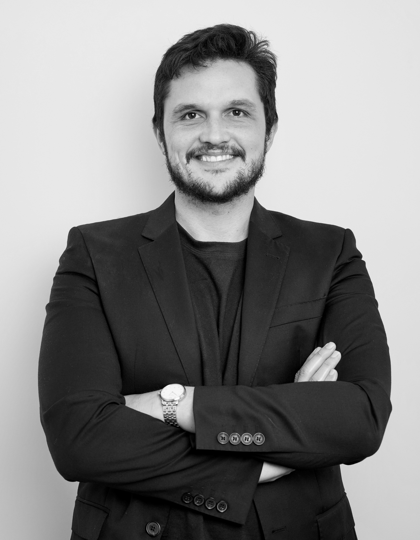 A man in a black suit. 