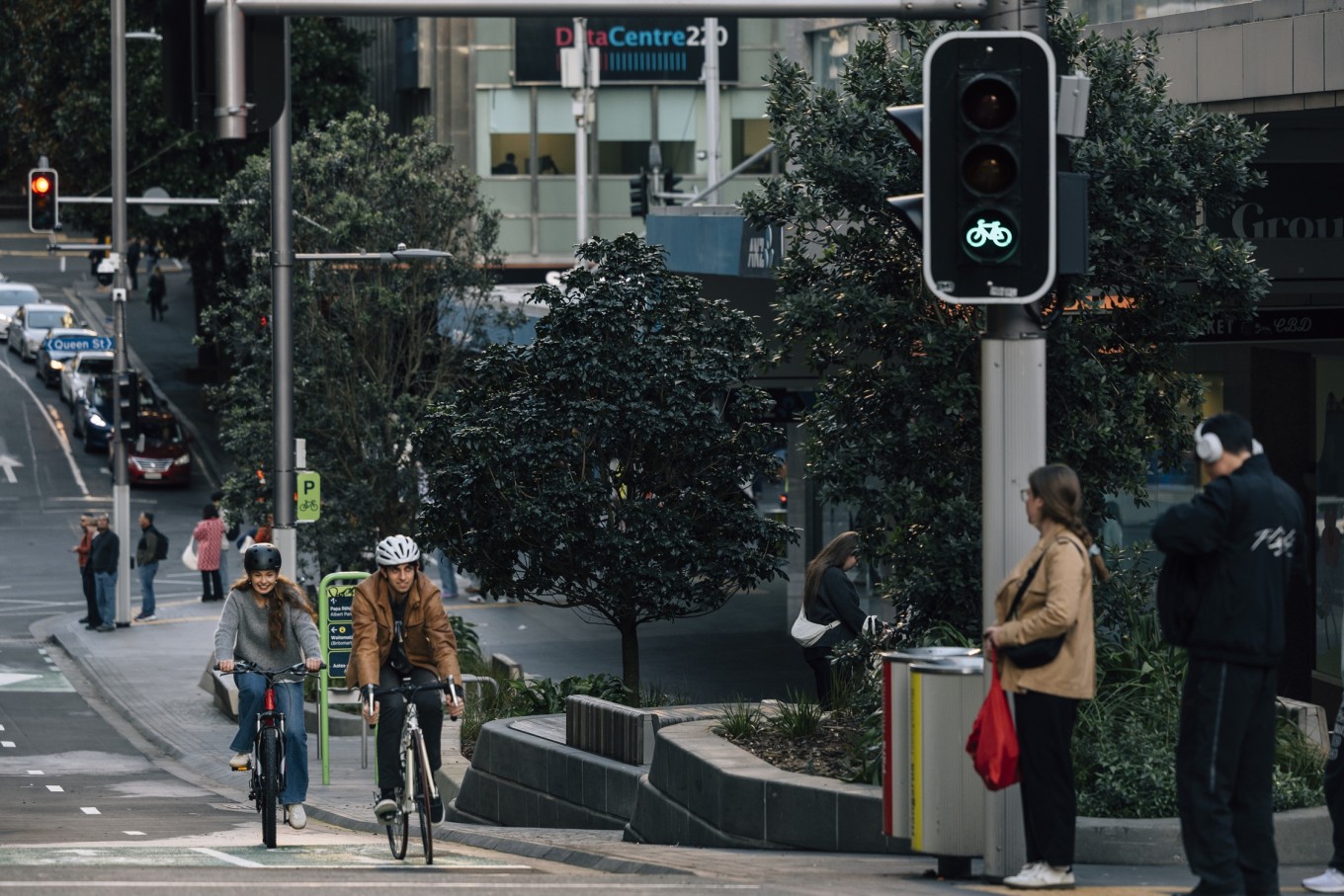Cyclists riding up the Victoria St cycleway. 