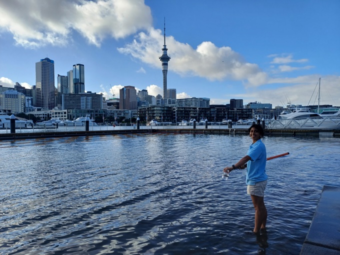 Healthy Waters intern Deshma Weerapperuma collecting water samples at the Viaduct Basin
