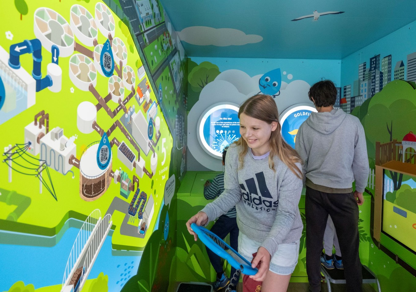 Kids playing at the WaterCare plant.