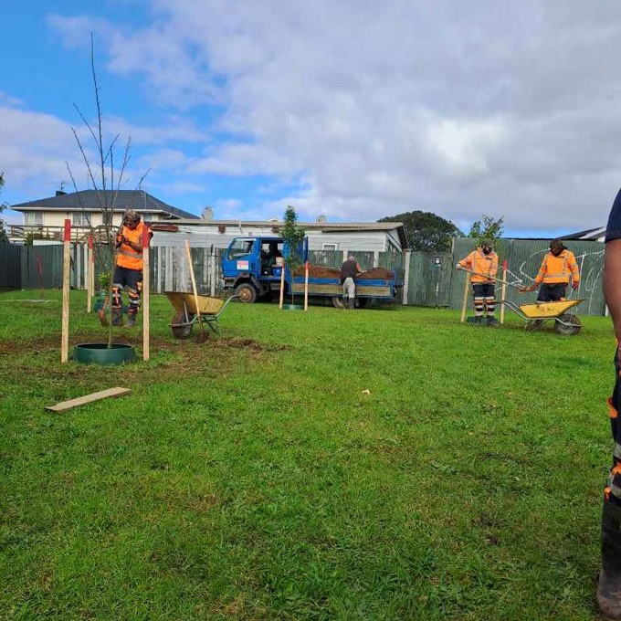 Workers planting in a field