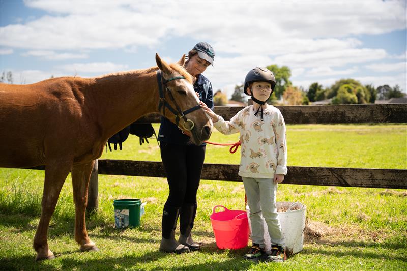 A horse worker with child. 