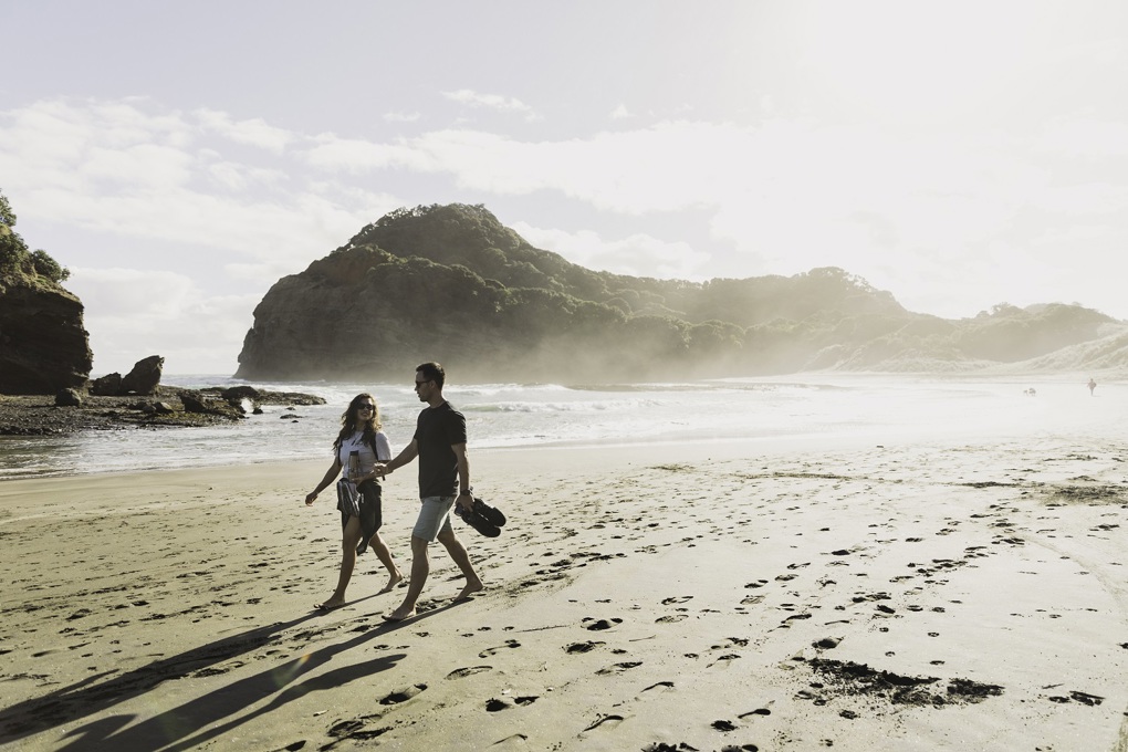 Woman And Man Enjoying A Beach Walk Resize