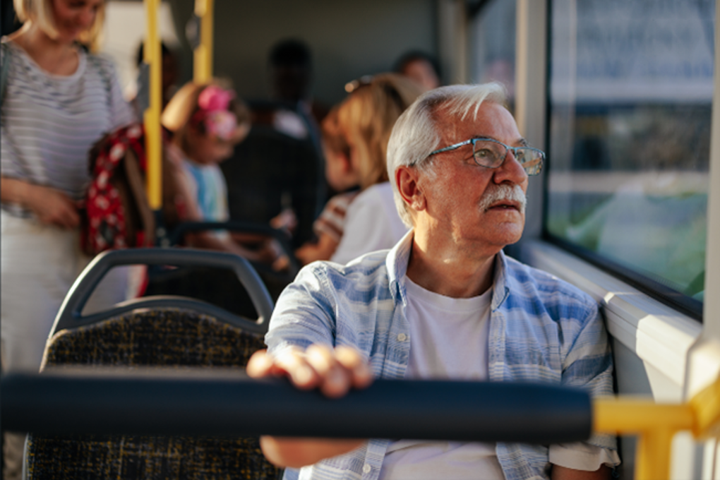 Senior Man Sitting On A Bus AT Suppied